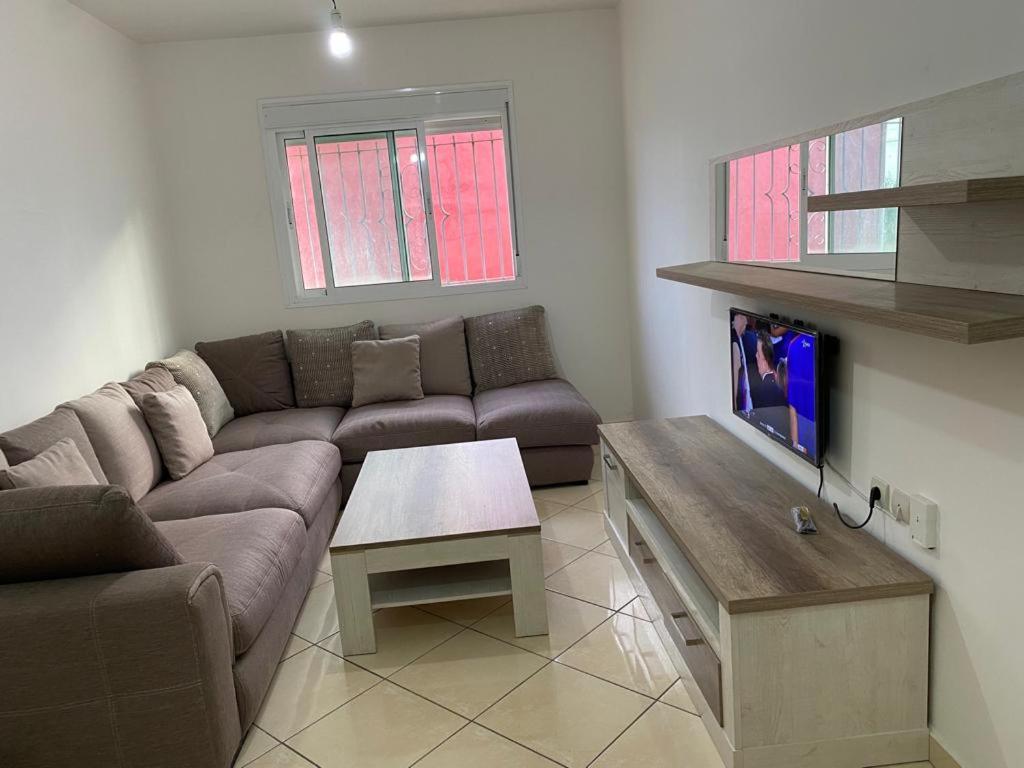 a living room with a couch and a coffee table at Appartement à Louer entre Tetouan et Martil in Tetouan