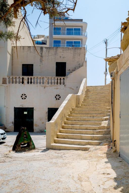 a set of stairs in front of a building at Salini Suites in Żebbuġ