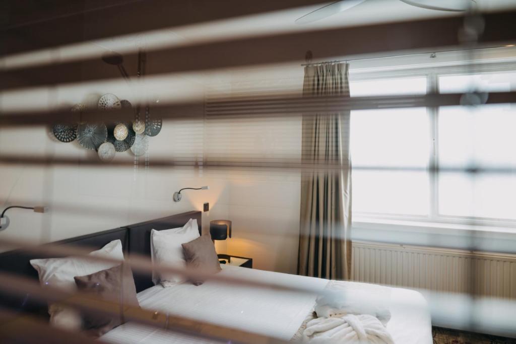 Cama o camas de una habitación en Hotel Astoria Gent