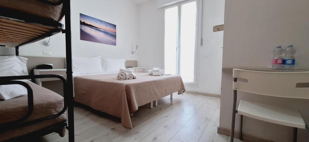 Postel nebo postele na pokoji v ubytování Hotel Sasselli