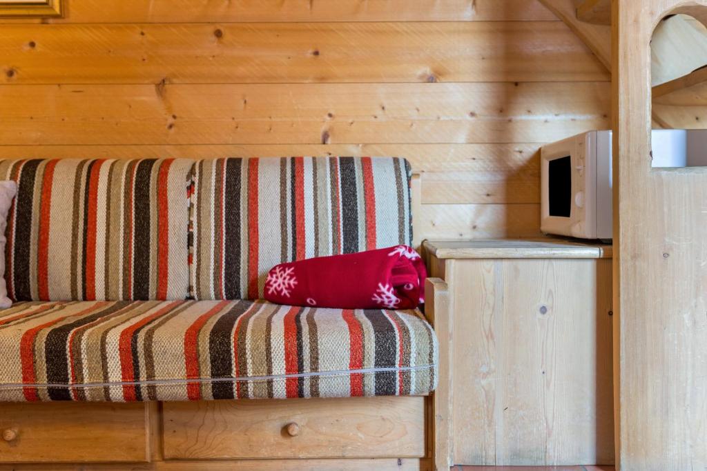 Postel nebo postele na pokoji v ubytování Baita Pecol Passo Pordoi