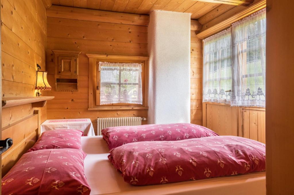 Postel nebo postele na pokoji v ubytování Baita Pecol Passo Pordoi