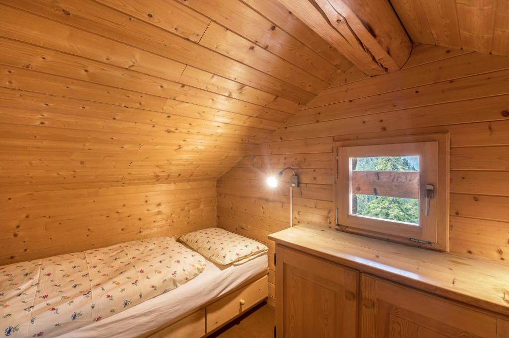 Postel nebo postele na pokoji v ubytování Baita Pecol Passo Pordoi