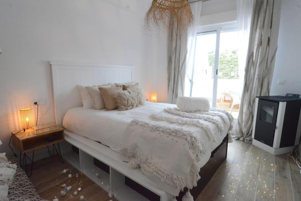 Ένα ή περισσότερα κρεβάτια σε δωμάτιο στο La Cueva de Las Orquídeas