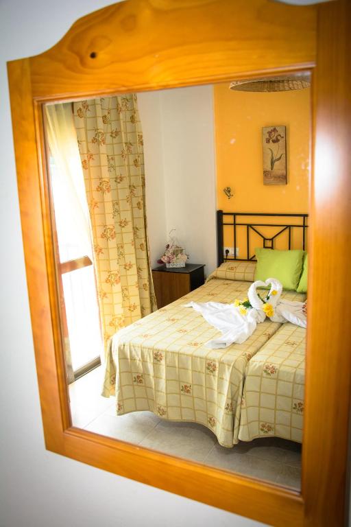 Posteľ alebo postele v izbe v ubytovaní Hostal Malia