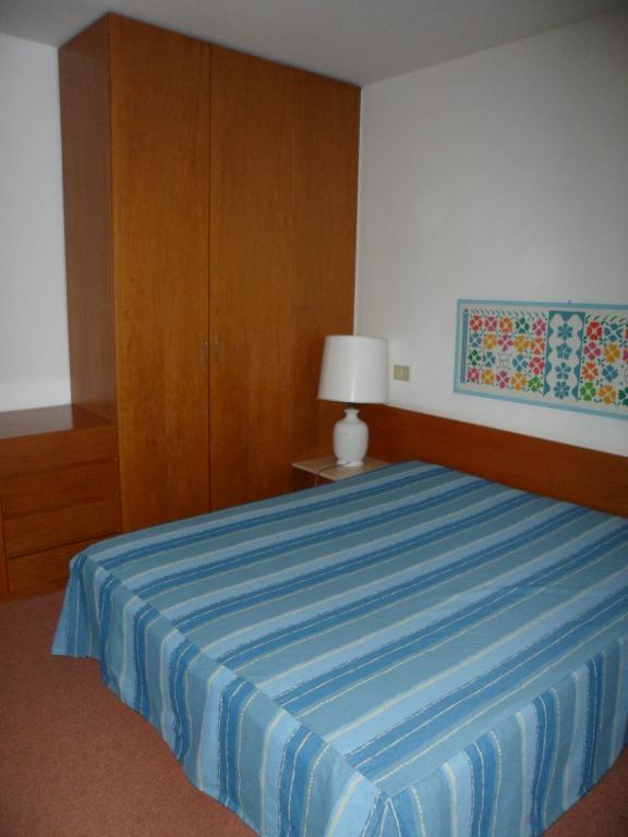 Postel nebo postele na pokoji v ubytování Appartamento 109 - Multiproprietà I Boboli BC