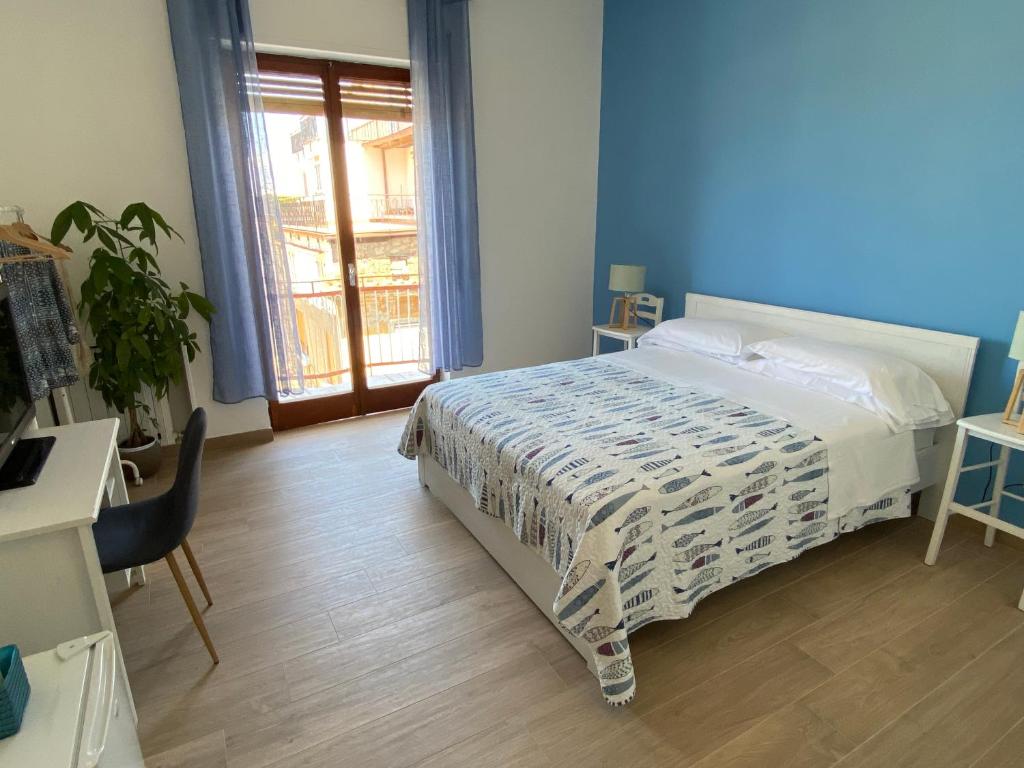 Łóżko lub łóżka w pokoju w obiekcie B&B Syrentum