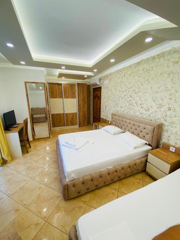 Postel nebo postele na pokoji v ubytování Apart Hotel Llolla
