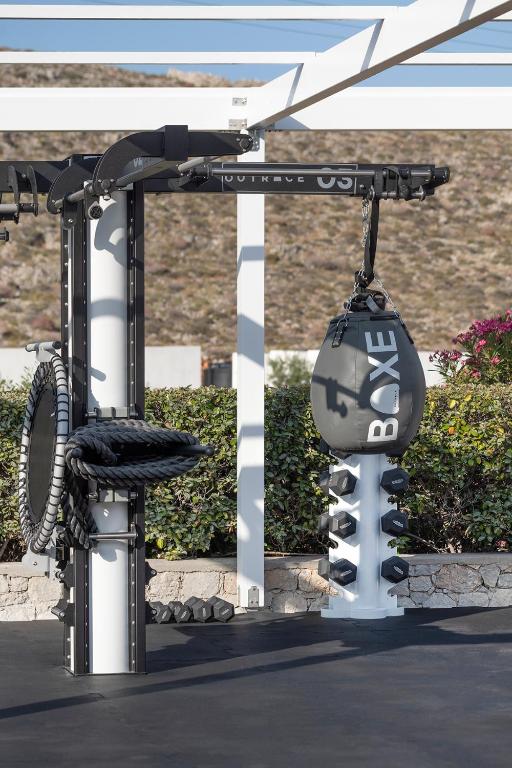 a carousel with a bike hanging from a pole at ANEMI Folegandros in Karavostasi
