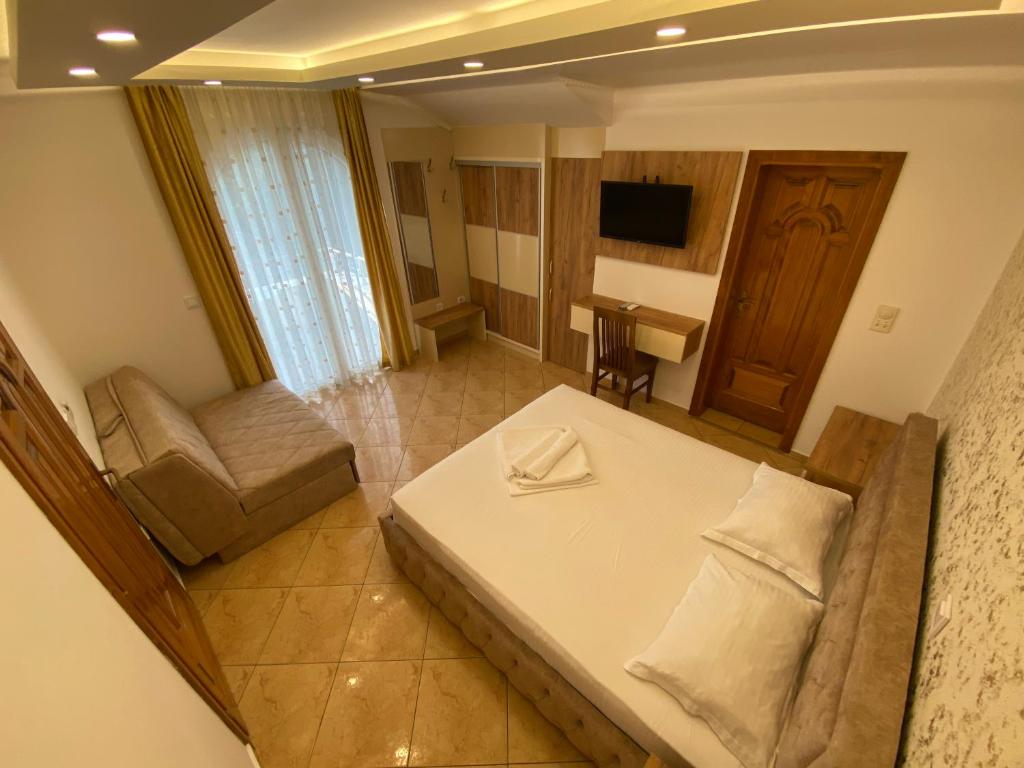 Postel nebo postele na pokoji v ubytování Apart Hotel Llolla