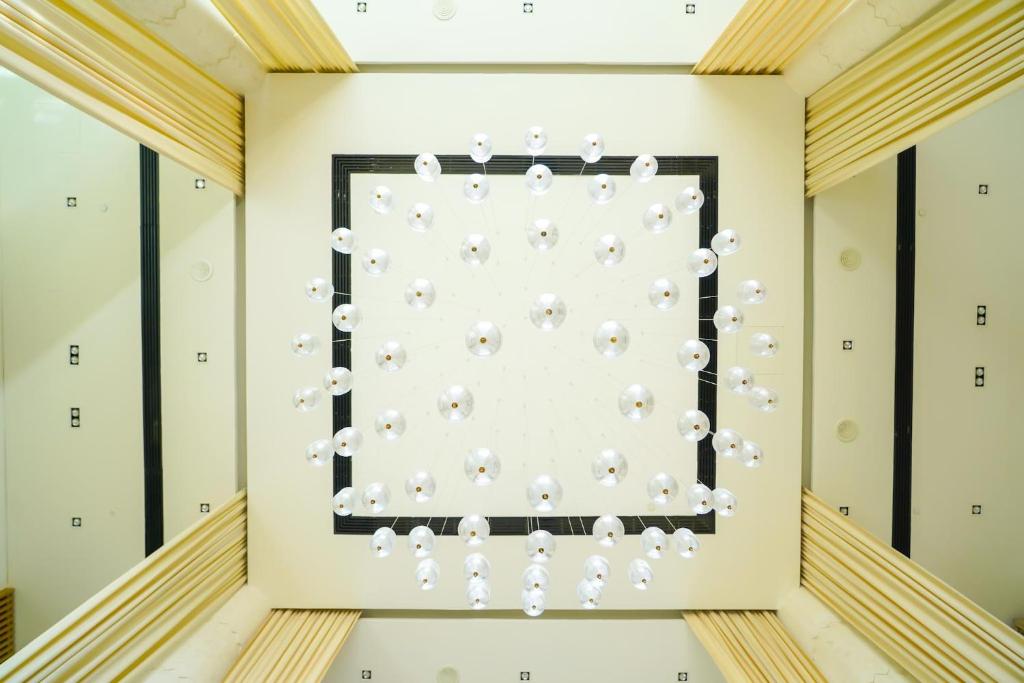 a room with a wall filled with white balloons at Andalus Al Seef Resort & Spa in Abu Dhabi