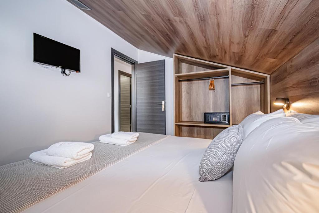 Postel nebo postele na pokoji v ubytování Evitel Luxury Living