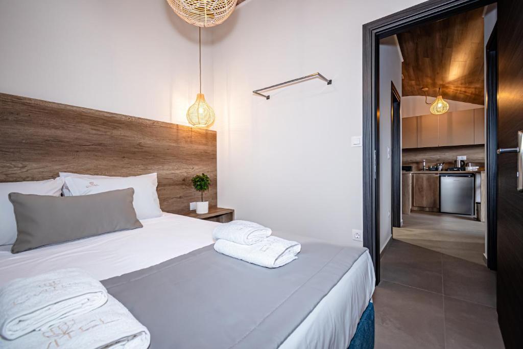 Postel nebo postele na pokoji v ubytování Evitel Luxury Living