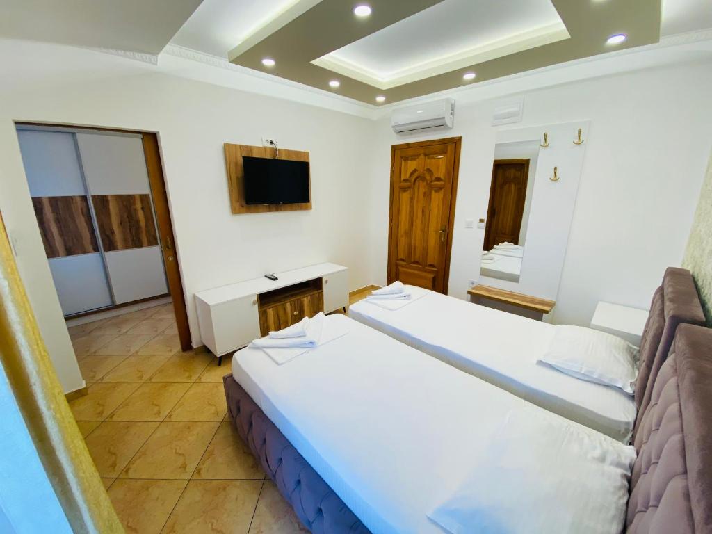 Postel nebo postele na pokoji v ubytování Apart Hotel Llolla