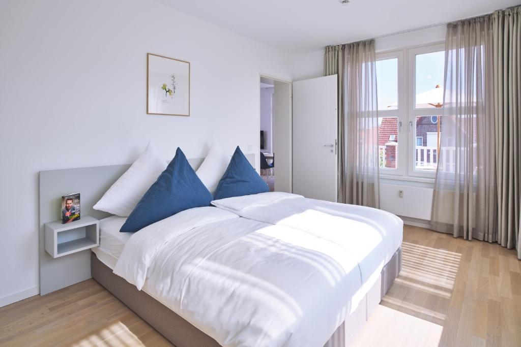 Postel nebo postele na pokoji v ubytování Lüttjeod Apartmentvilla Lüttjeod Apartmentvilla 08