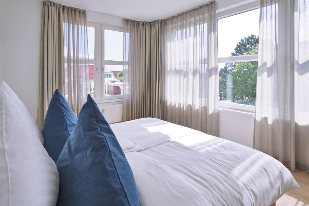 Postel nebo postele na pokoji v ubytování Lüttjeod Apartmentvilla Lüttjeod Apartmentvilla 08