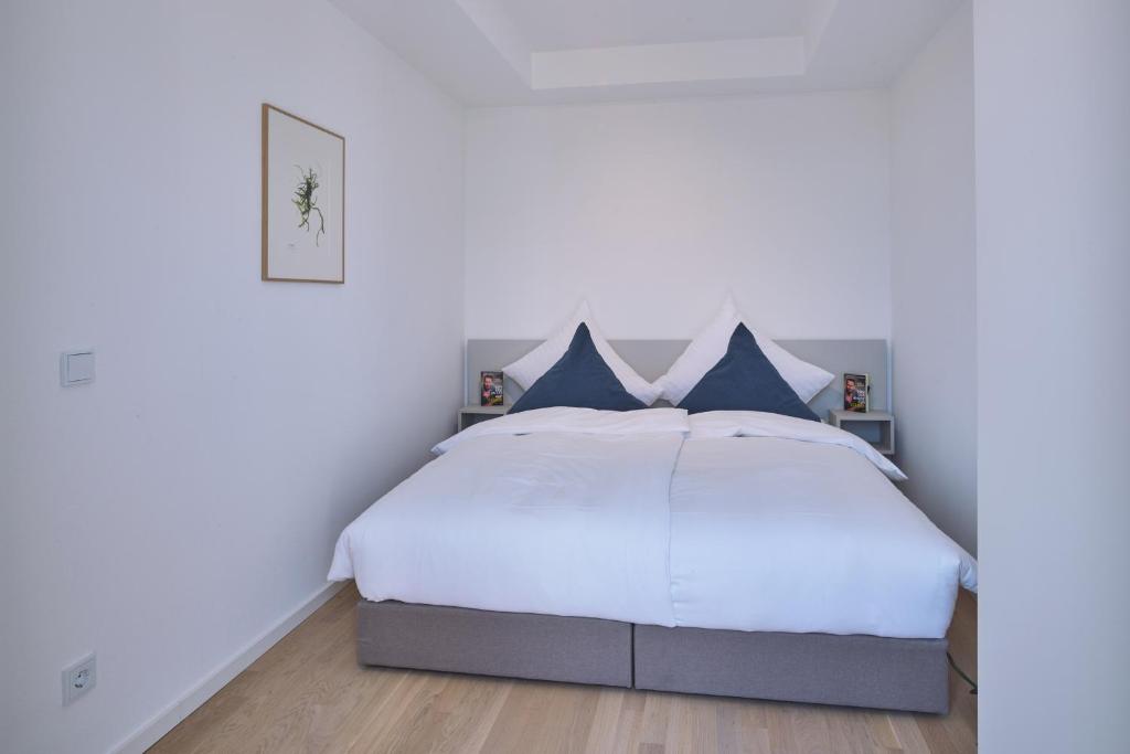 Postel nebo postele na pokoji v ubytování Lüttjeod Apartmentvilla Lüttjeod Apartmentvilla 08