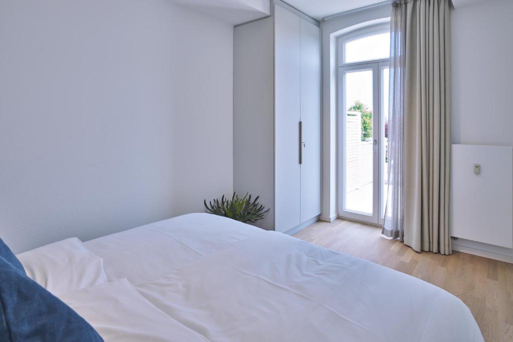 Postel nebo postele na pokoji v ubytování Lüttjeod Apartmentvilla Lüttjeod Apartmentvilla 08