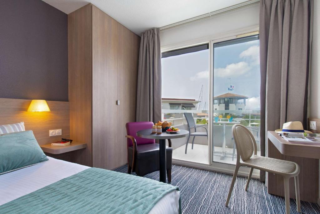 Postel nebo postele na pokoji v ubytování Best Western Plus La Marina