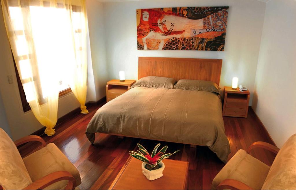 Postel nebo postele na pokoji v ubytování Hotel Casa Deco