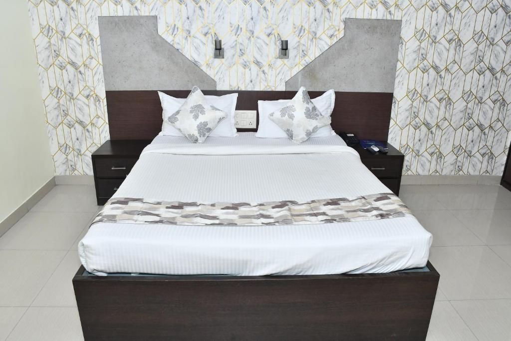 Ένα ή περισσότερα κρεβάτια σε δωμάτιο στο PARK PRIDE INN