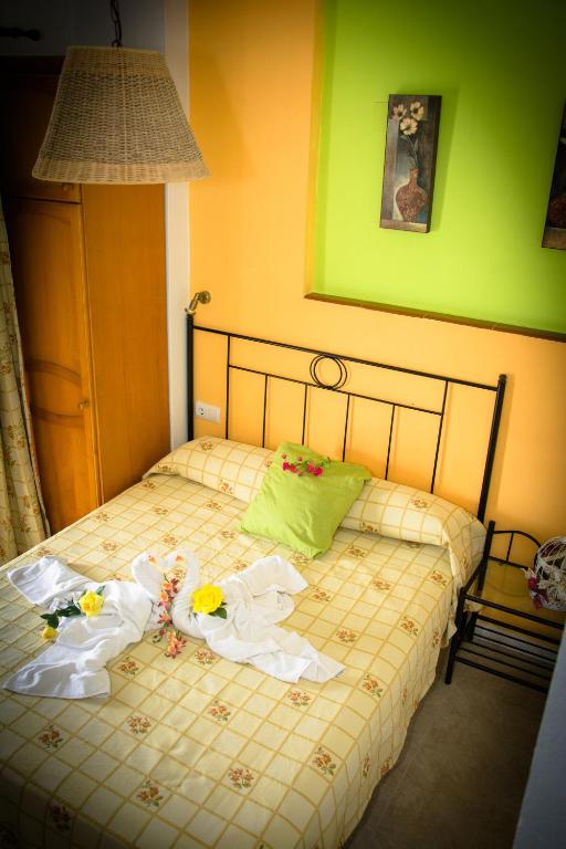 Posteľ alebo postele v izbe v ubytovaní Hostal Malia