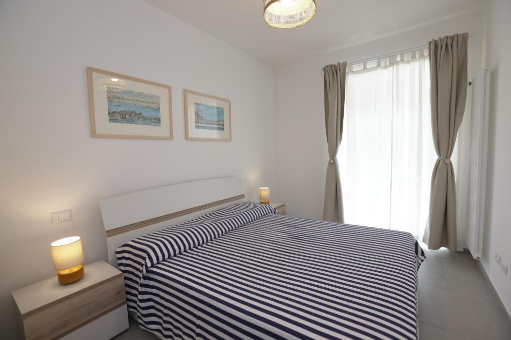 Postel nebo postele na pokoji v ubytování Adamaina - Sea view apartment with private garage