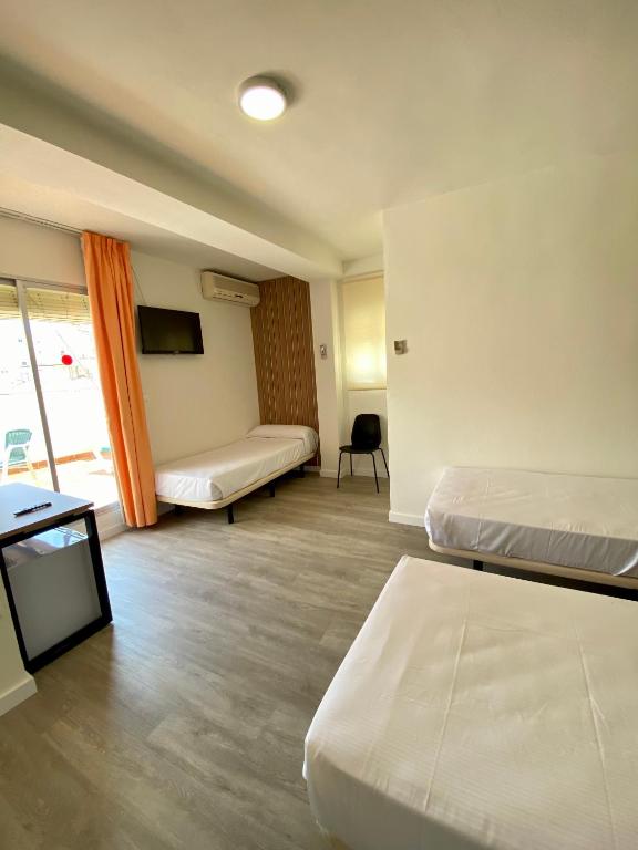 Postel nebo postele na pokoji v ubytování Hotel Victoria Centro