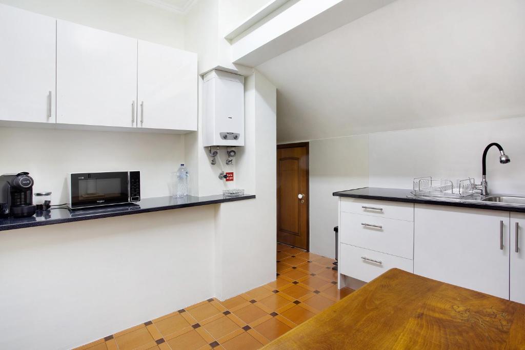 Kuchyň nebo kuchyňský kout v ubytování Penthouse Vista Mar