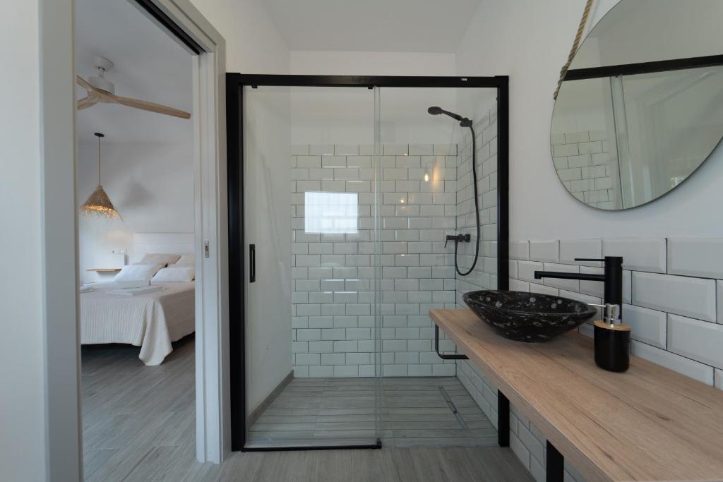 a bathroom with a sink and a mirror at Calas De Meca in Los Caños de Meca