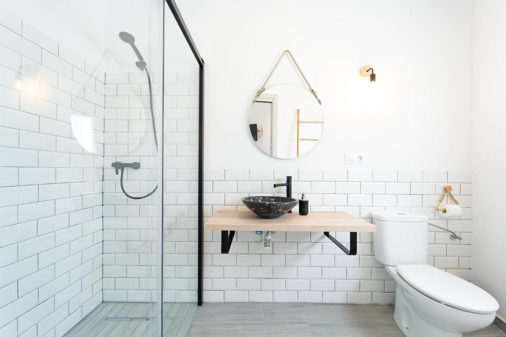 a bathroom with a shower and a toilet and a sink at Calas De Meca in Los Caños de Meca