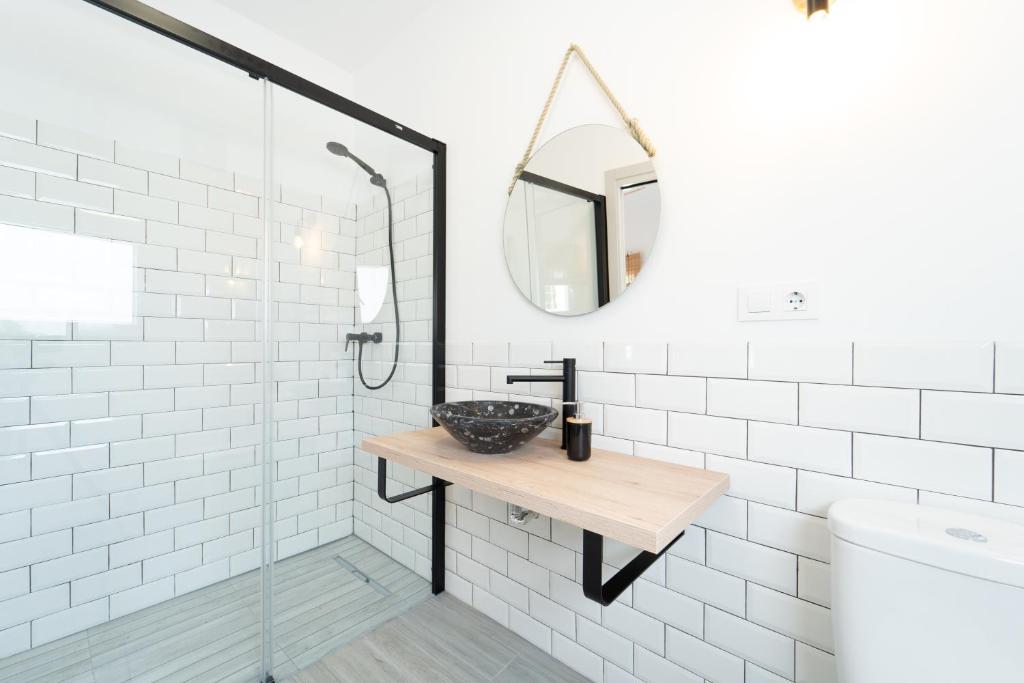 a bathroom with a sink and a mirror at Calas De Meca in Los Caños de Meca