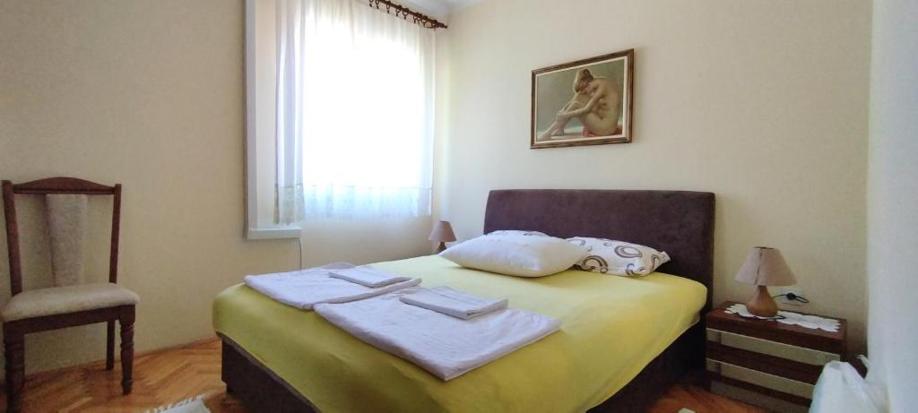 Postel nebo postele na pokoji v ubytování Guesthouse Gavrilović 28 A