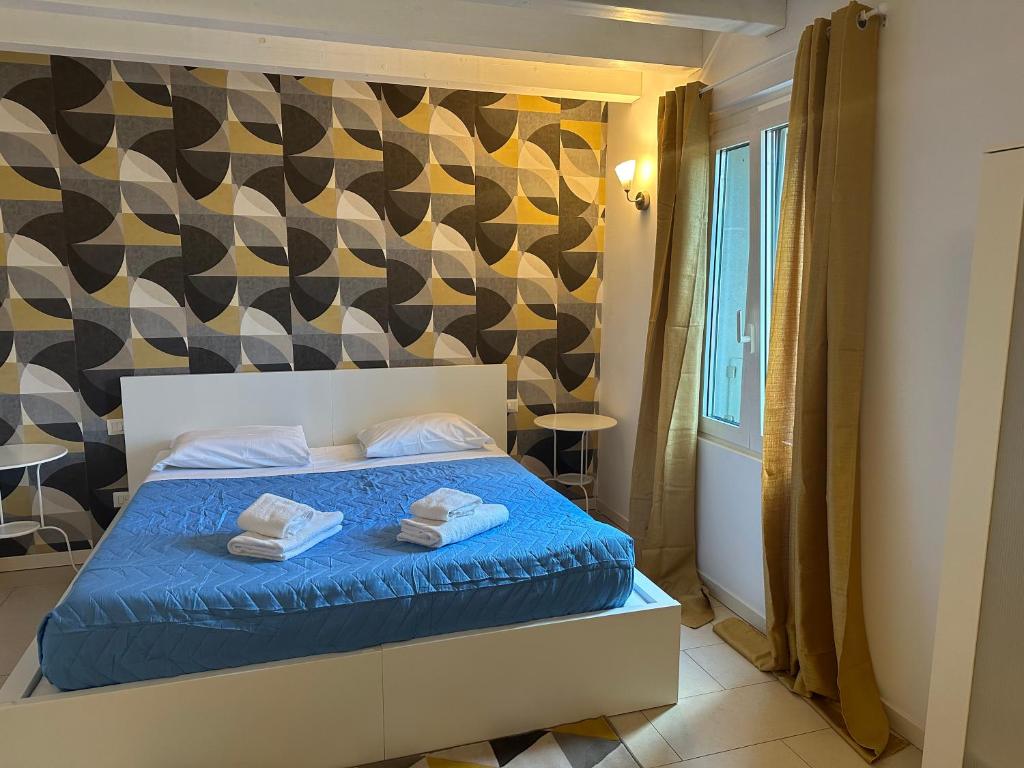 Postel nebo postele na pokoji v ubytování FEEL - Accademia Carrara Apartment