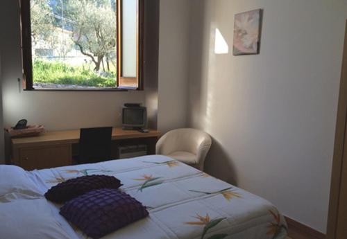 Postel nebo postele na pokoji v ubytování Bellaria Relais