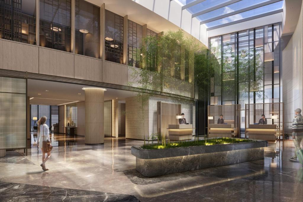 a rendering of the lobby of a building at Courtyard by Marriott Hangzhou Xihu in Hangzhou