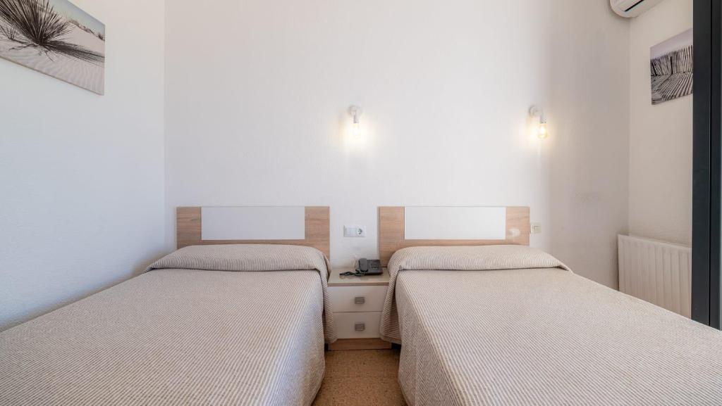 Postel nebo postele na pokoji v ubytování Solymar