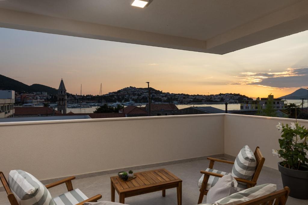 a balcony with a view of a city at Apartments aMare in Dubrovnik