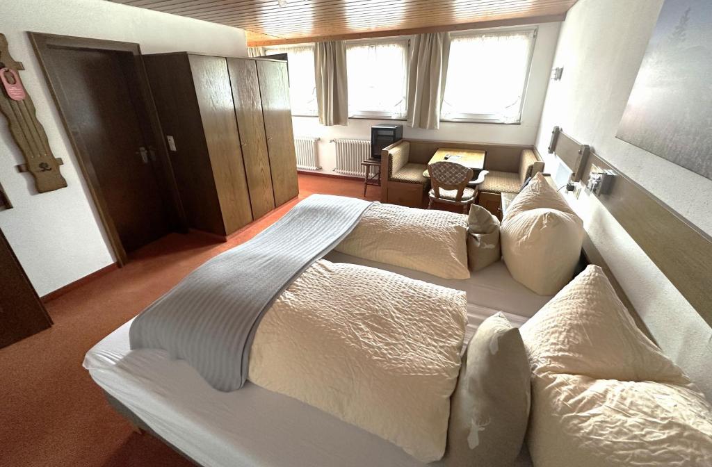 Postel nebo postele na pokoji v ubytování Hotel Zartenbach