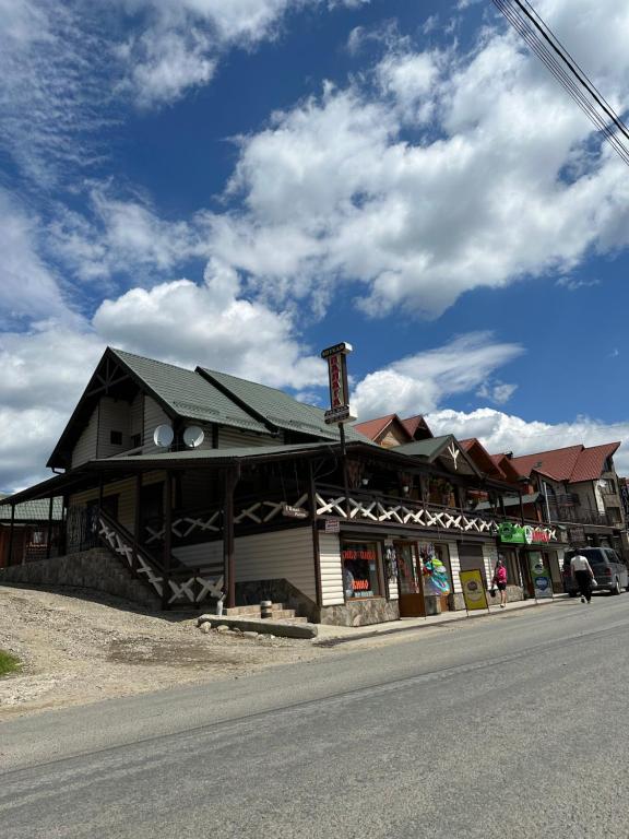 a building on the side of a street at Palaga Bukovel in Bukovel