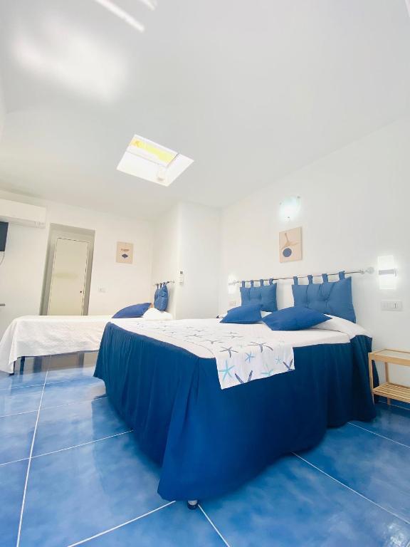 Postel nebo postele na pokoji v ubytování Casa Leo
