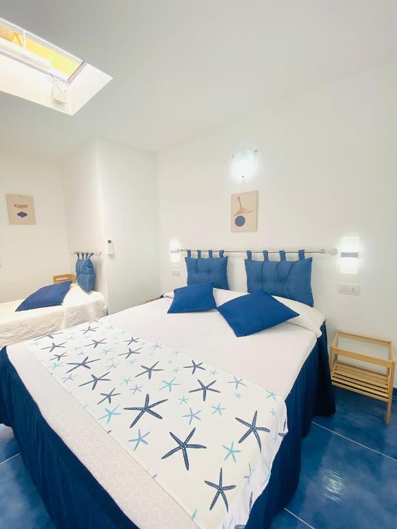 Postel nebo postele na pokoji v ubytování Casa Leo