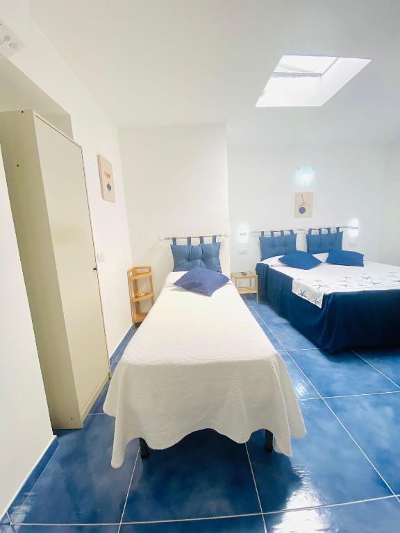 Postel nebo postele na pokoji v ubytování Casa Leo
