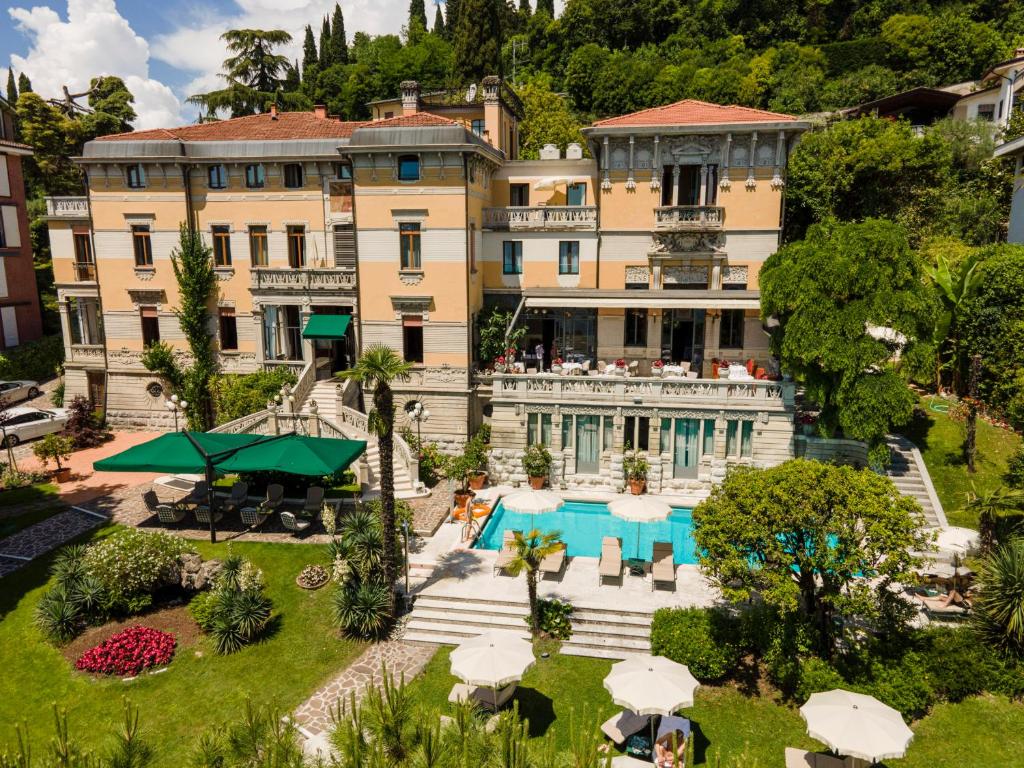 an aerial view of a building with a swimming pool at Hotel Laurin in Salò