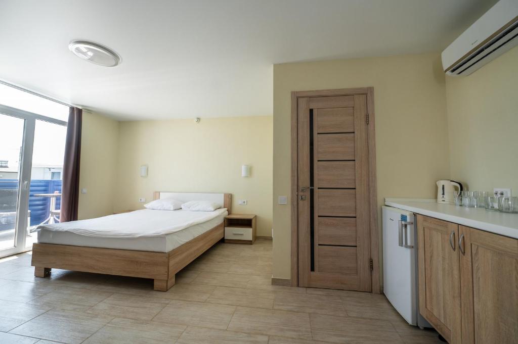 Postel nebo postele na pokoji v ubytování Weekend Family Hotel