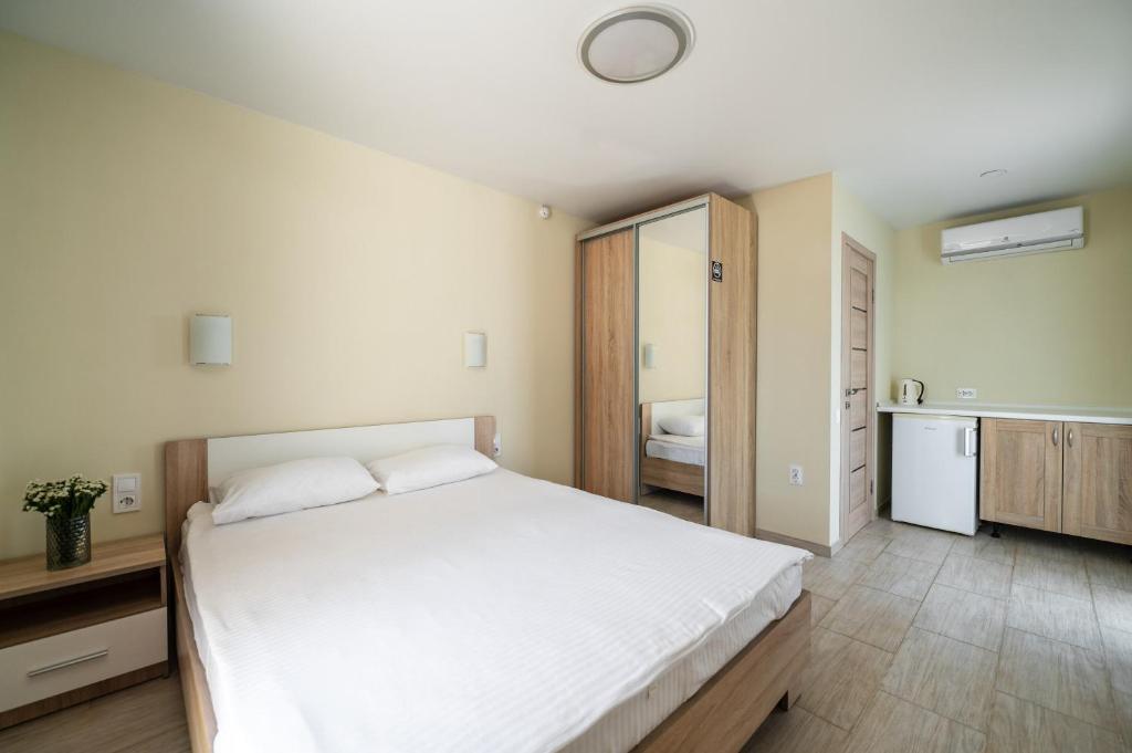 Postel nebo postele na pokoji v ubytování Weekend Family Hotel