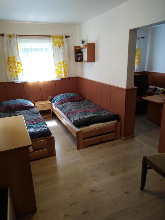 Postel nebo postele na pokoji v ubytování Chata pod Lysou Horou