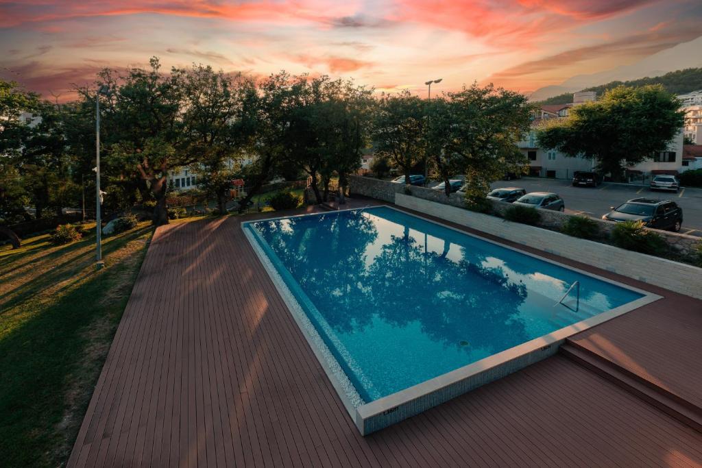 a swimming pool on the roof of a building at Eurostars Queen of Montenegro in Budva