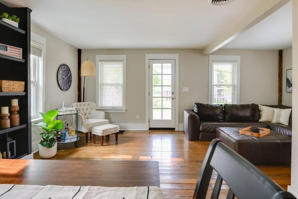 a living room with a couch and a table at Bell Street by the Falls in Chagrin Falls