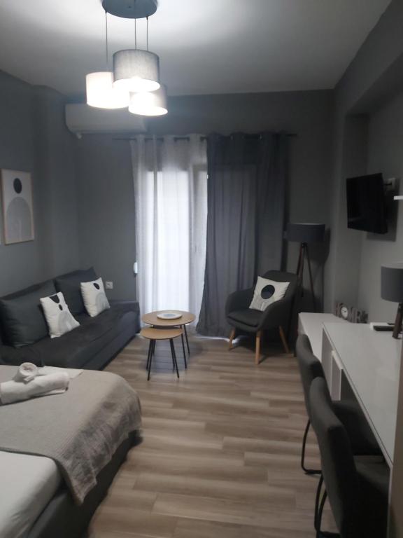 a living room with a bed and a couch at Nantias Luxury Home in Alexandroupoli